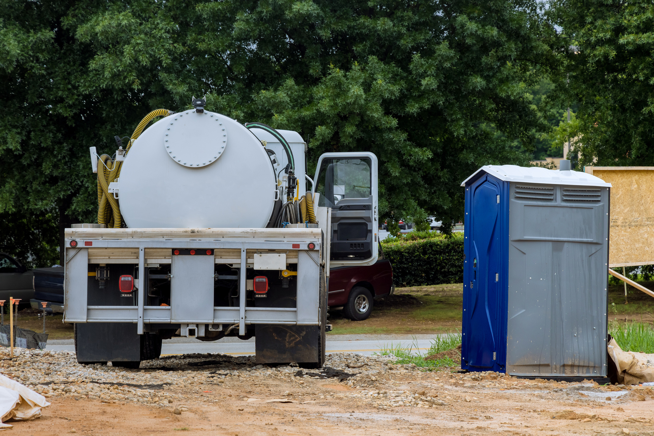 Cleaning portable restrooms with the help of a septic truck